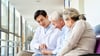 Doctor talking to older patient and his wife